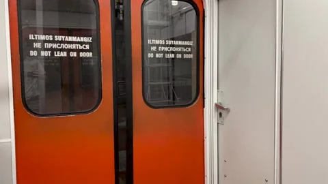 Closing the doors of the train in the subway. orange old vintage doors Stock Footage 249689286