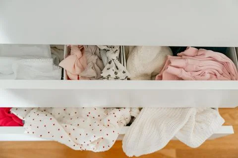 Closing drawer with clothes Stock Photos