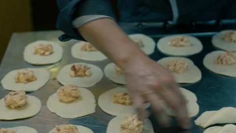 Closing up filled panzerotti with hands Stock Footage 86170069