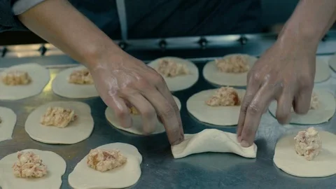 Closing up filled panzerotti with hands Video stock 86170070