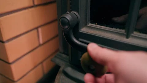 Closing the fireplace door. Close-up of the handle Stock Footage 321828278