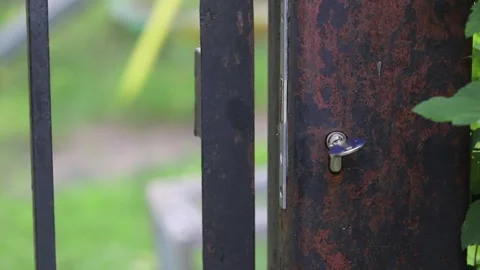 Closing A Gate In  Park Stock Footage 258073916