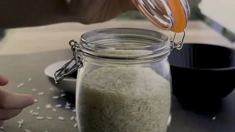 Closing glass jar with toggle clamp filled with basmati rice, FHD 스톡 동영상 342362978