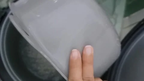 Closing the Inner Pot of a Rice Cooker Stock Footage 331415053