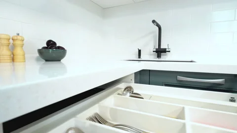 Closing kitchen drawer. Organization of the space of cutlery in kitchen Stock Footage 163890639
