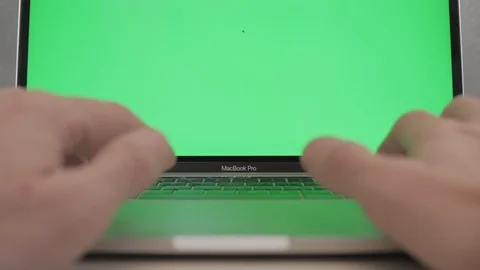 Closing a laptop with green screen Stock Footage 120594767