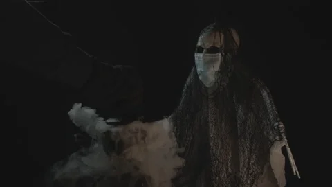 Closing lid on Smoking Cauldron by Skeleton Wearing Face Mask | Slow-Mo Stock Footage 138601600