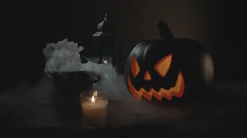 Closing Lid on Steaming Boiling Cauldron next to Jack-O-Lantern in Slow-Mo Stock Footage 138244170