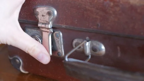Closing the lock of an old suitcase Stock Footage 87496773