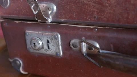 Closing the lock of an old suitcase Stock Footage 88125597
