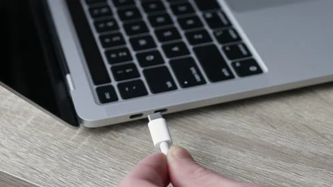 Closing the male hand inserts the USB cable type C Stock Footage 185124670