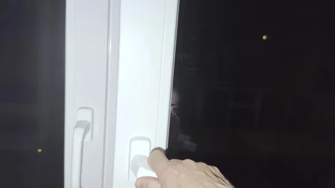 Closing an Open Window During the Night Stock Footage 341297998