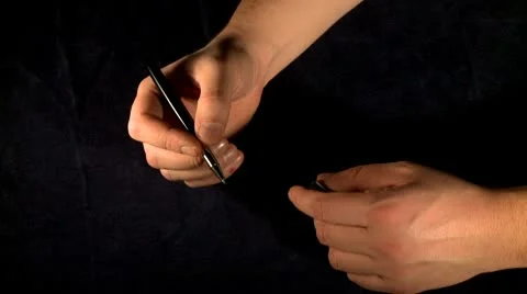 Closing pen with two hands 2 Stock Footage 10607002