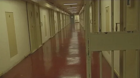 Closing Prison Jail door to hallway Stock Footage