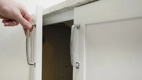 Closing a soft-close cabinet in a bathroom remodel. Stock Footage 286713877