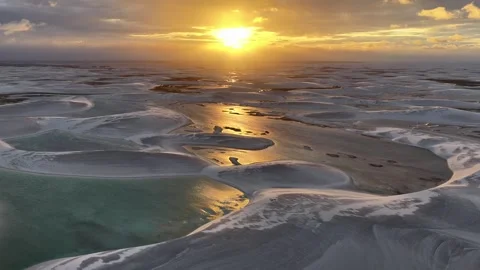 Closing In on Sunset Over Reflective Lagoons in Lençóis Maranhenses Stock Footage 342442914