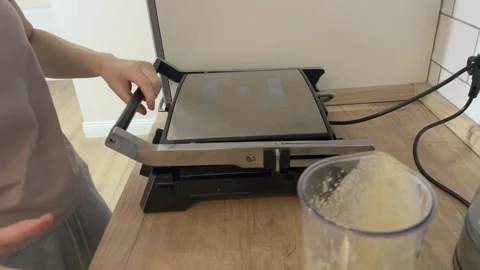 Closing Waffle Maker And Adjusting Temperature Cooking Homemade Waffles Process Video stock 336442750