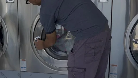 Closing the washing machine door Video stock 310228474