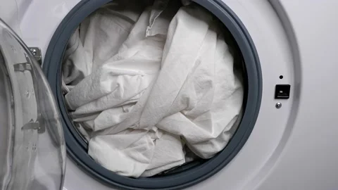 Closing the washing machine. Laundry. Stock Footage 165674801