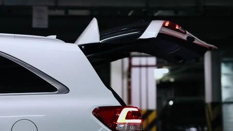 Closing of white car boot with yellow rear light on Video stock 276370547