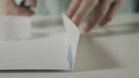 Closing a white envelope Stock Footage 340960269