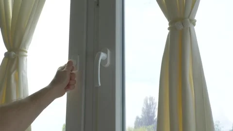 Closing a window in a house, a person closes metal-plastic windows Stock Footage 336466301