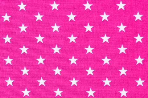 Cloth background texture of pink textile with white star pattern Stock Photos