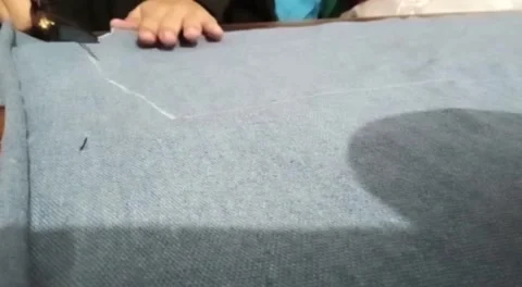 Cloth is being cut by someone Stock Footage 282260367