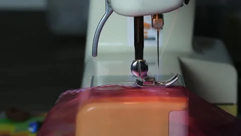 Cloth being guided through a sewing machine Stock Footage 11252308