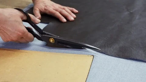 Cloth cutting scissors cut artificial leather Stock Footage 88450513