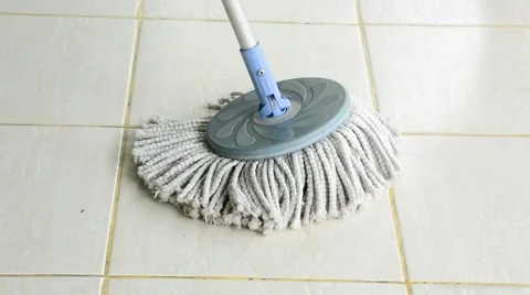 Cloth mop clean a white tile floor as housekeeping housework tool for housewife Видео 58942875