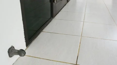 Cloth mop moving to clean a white tile floor as housekeeping housework tool Видео 58942989