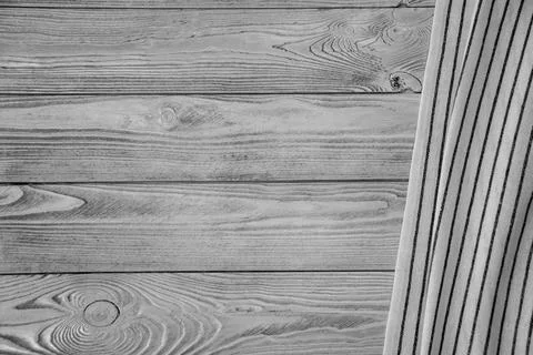 Cloth napkin on the background of a table from a rustic wooden board, top vie Stock Photos