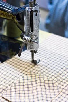 Cloth with a sewing machine Stock Photos