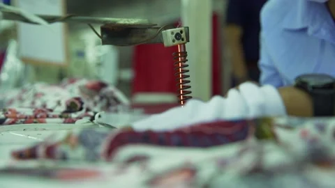 Clothe burning with sewing machine in garment factory indonesia Video stock 210161707
