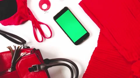 Clothes and accessory modern collection, smartphone with green screen Stock Footage 189960219