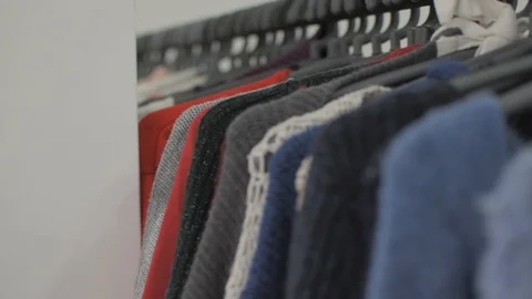 Clothes and stuff in boutique store. Camera panning to the right. Focus Video stock 127351277