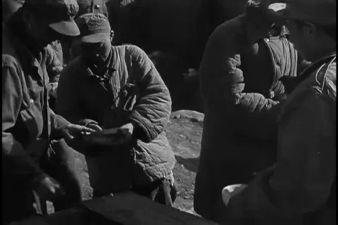 Clothes and utensils are distributed to POW - 1951 Vídeo Stock 106048666