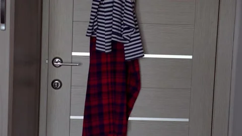 Clothes are hanging on the door Video stock 153780916