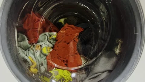 Clothes are washed in a washing machine. The process of washing things in a Video stock 274654618