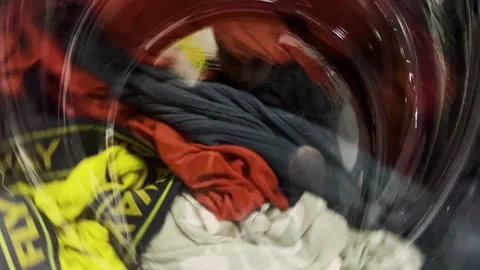 Clothes are washed in a washing machine. The process of washing things in a Stock Footage 275242657