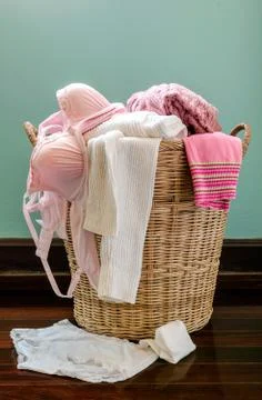 Clothes in  basket Stock Photos