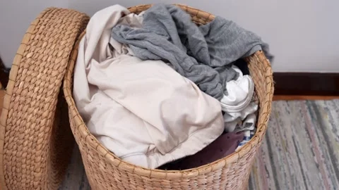 Clothes Being Tossed into a Laundry Basket Stock Footage 291694504