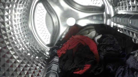Clothes being washed, rinse and spin inside of the drum of the washer Stock Footage 124352179