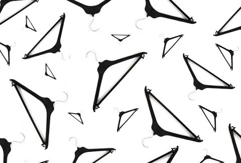 Clothes black Hangers Pattern On A White Background. Concept of discounts and Stock-Fotos