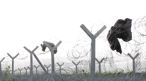 Clothes on Border Razor Fence Stock Footage 64847287