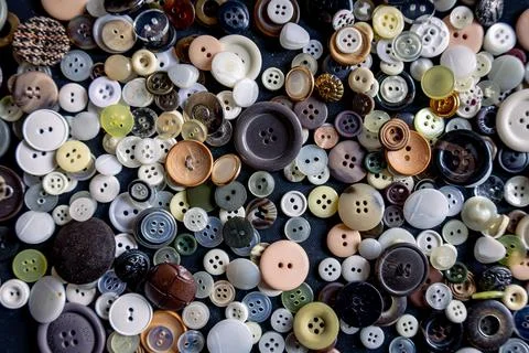 Clothes buttons in a pile of different sizes and colors Stock Photos
