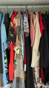 Clothes in closet Stock Photos