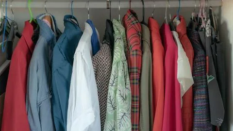 Clothes in closet Stock Photos