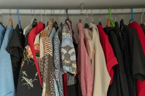 Clothes in closet Stock Photos